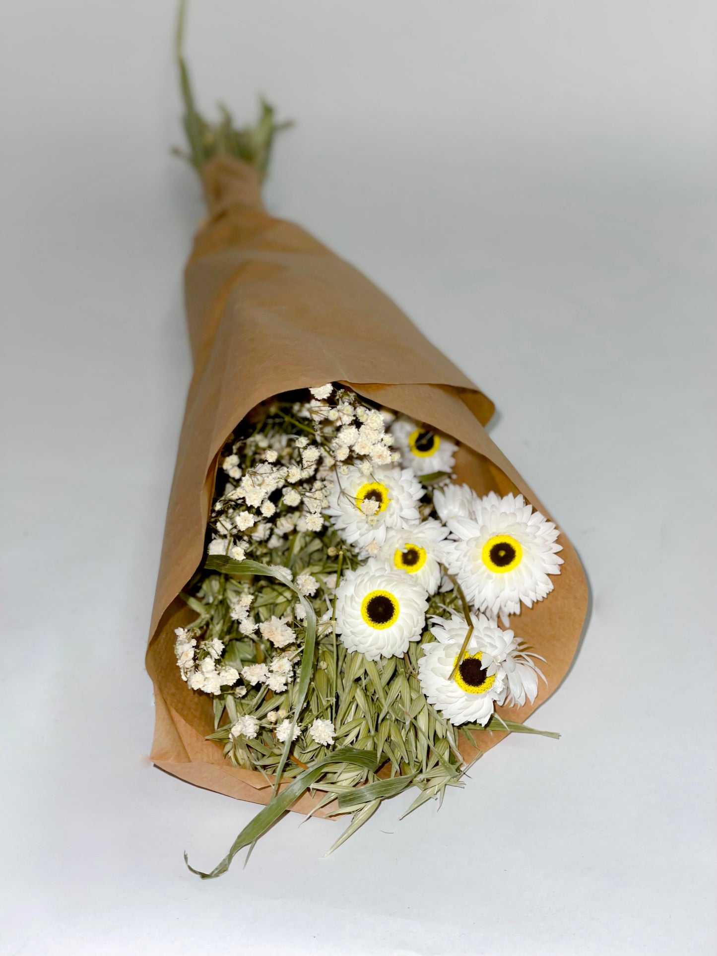 Bouquet of dried green and white flowers