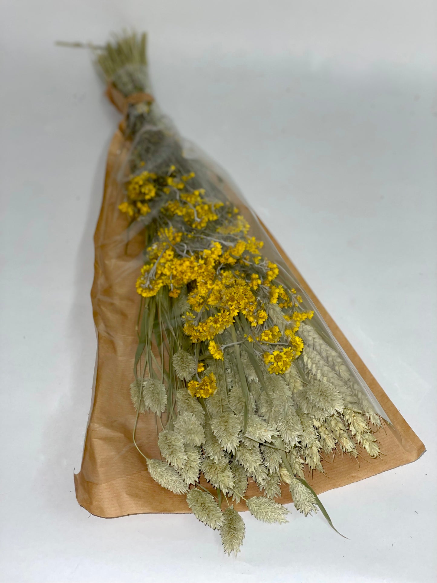 Bouquet of yellow green dried flowers