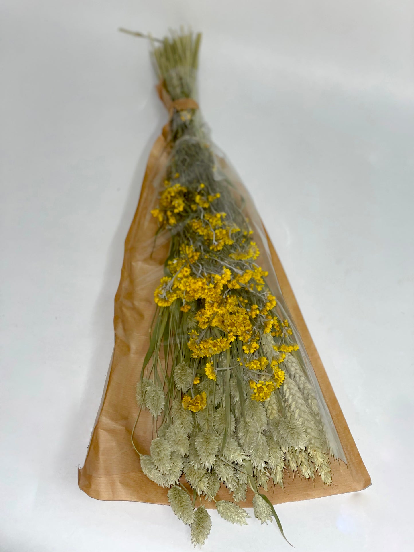 Bouquet of yellow green dried flowers
